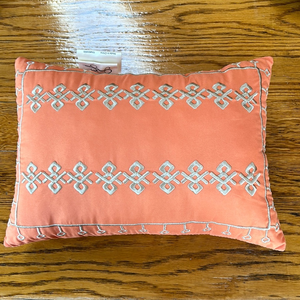 Jessica Simpson accent pillow.  Orange w/tan embroidery on one side.  12”x16.5”